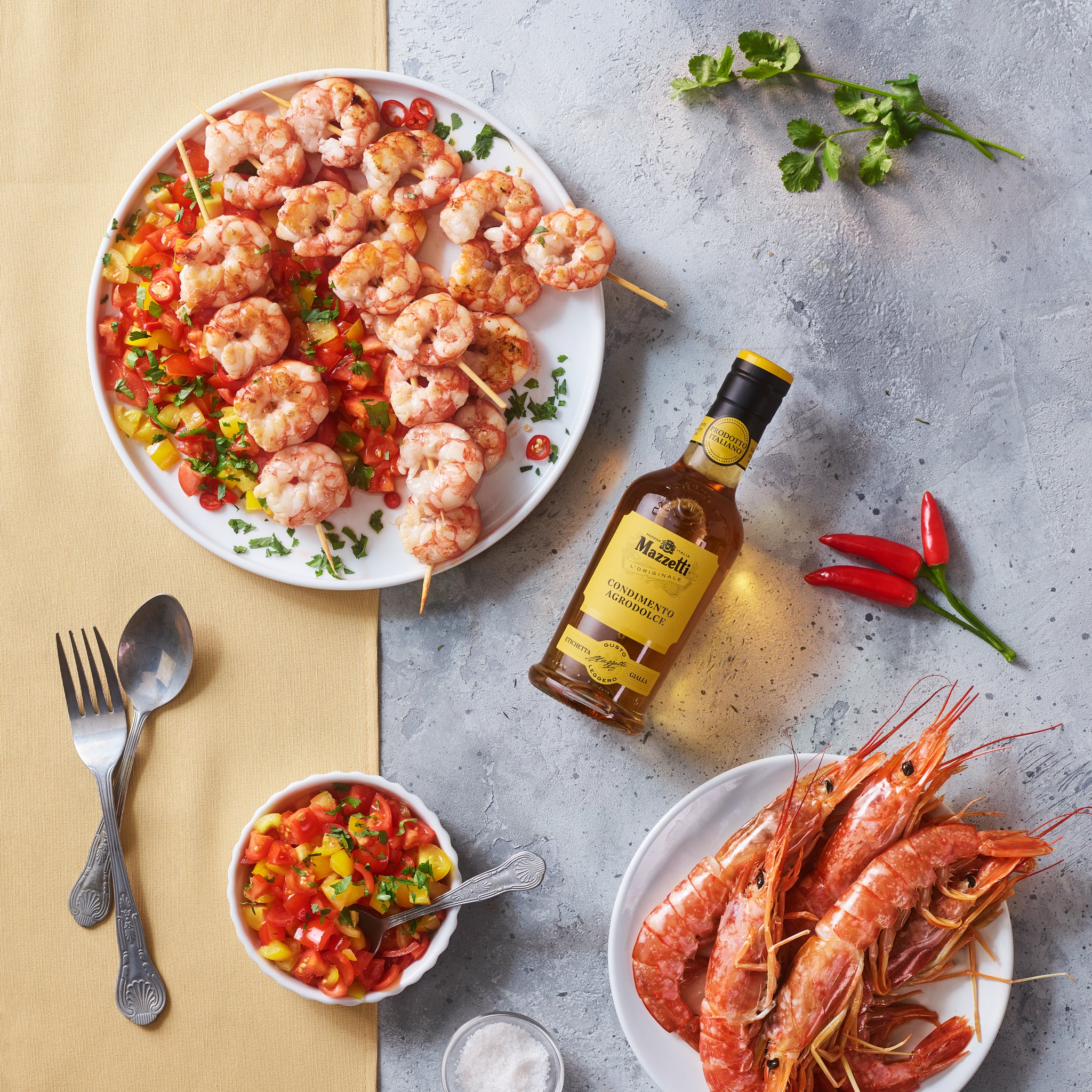 Prawn skewers with tomatoes, fresh chilli, coriander and White Condiment