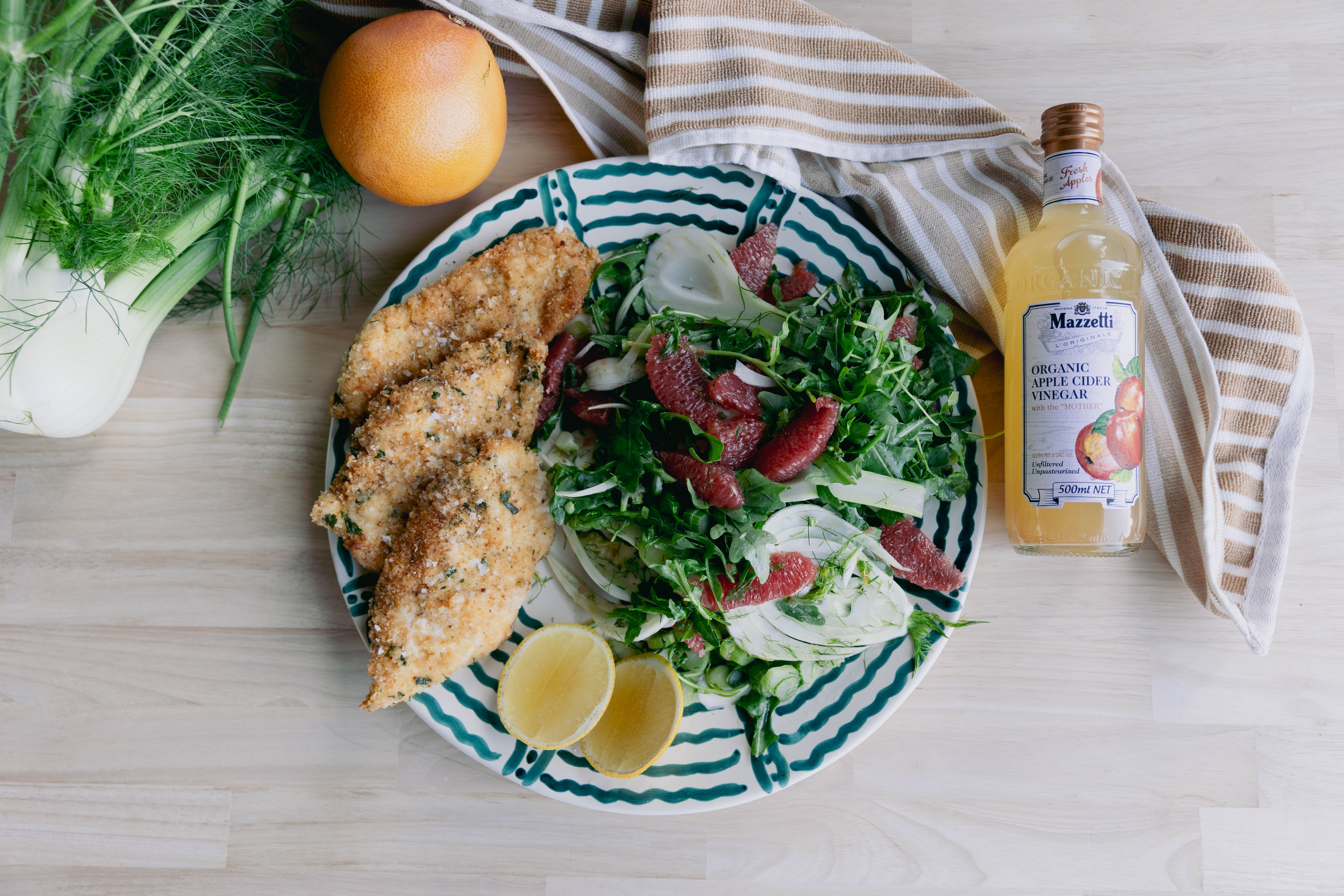Chicken Cotoletta with ruby grapefruit, rocket & fennel salad